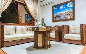 Posezení v ubytování Hivernage Secret Suites & Garden