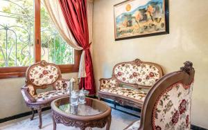 Posezení v ubytování Hivernage Secret Suites & Garden
