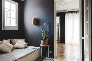 A bed or beds in a room at Brummell Apartments Gracia