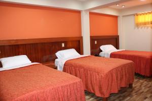 Postel nebo postele na pokoji v ubytování Sumaq Hotel Tacna
