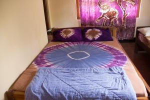 En eller flere senge i et værelse på Machame Nkweshoo Cultural Tourism