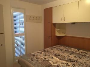 Ένα ή περισσότερα κρεβάτια σε δωμάτιο στο Appartement NoorderKragt, Amelander Kaap +66 φωτογραφίες