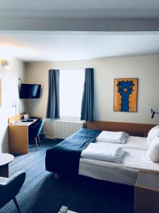 Postelja oz. postelje v sobi nastanitve Hotel Garni