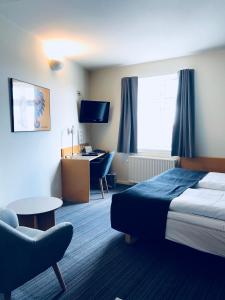 Postelja oz. postelje v sobi nastanitve Hotel Garni