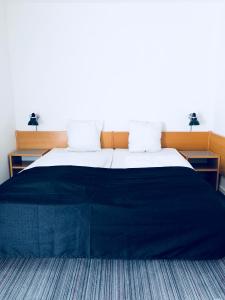 Postelja oz. postelje v sobi nastanitve Hotel Garni
