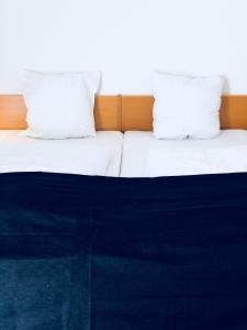 Postelja oz. postelje v sobi nastanitve Hotel Garni