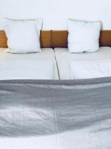 Postelja oz. postelje v sobi nastanitve Hotel Garni