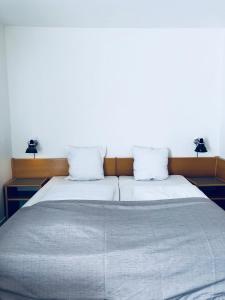Postelja oz. postelje v sobi nastanitve Hotel Garni