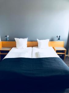 Postelja oz. postelje v sobi nastanitve Hotel Garni