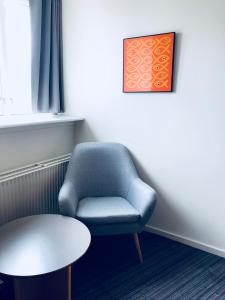 Predel za sedenje v nastanitvi Hotel Garni
