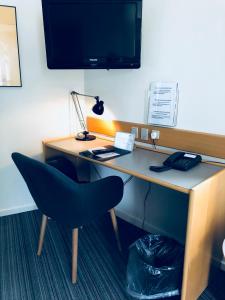 TV in/ali zabaviščno središče v nastanitvi Hotel Garni