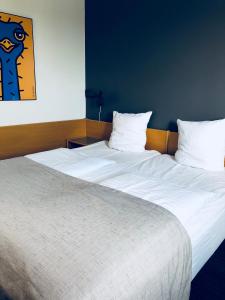 Postelja oz. postelje v sobi nastanitve Hotel Garni