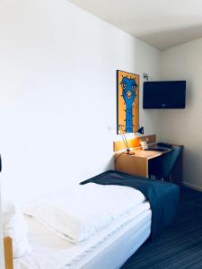 Postelja oz. postelje v sobi nastanitve Hotel Garni