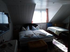 Tempat tidur dalam kamar di Pension Reichel
