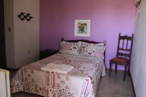 Un pat sau paturi într-o cameră la Pousada Vista Bela