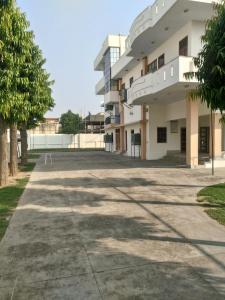 an empty parking lot in front of a building at Ashish Marriage Place in Jaipur