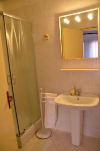 a bathroom with a sink and a shower at Villa Flamingo in Villasimius +51 photos