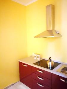 a kitchen with a sink and a stove top oven at La Caravella apartament in Rapallo