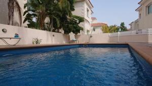 a swimming pool in front of a building at Palma Villa 14 in Protaras
