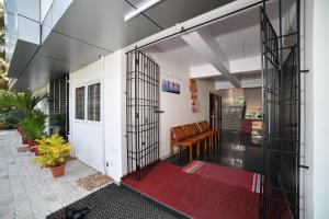 an open entrance to a house with a red rug at Indeevaram Residency in Trivandrum