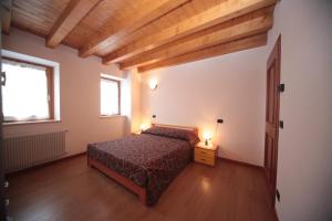 Rúm í herbergi á Albergo diffuso Valcellina e Val Vajont in Cimolais