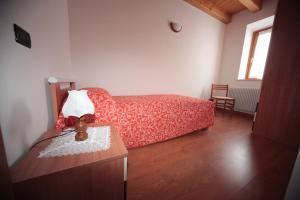 Rúm í herbergi á Albergo diffuso Valcellina e Val Vajont in Cimolais
