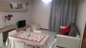 a small living room with a table and a couch at B&B Casa William in Castellammare di Stabia