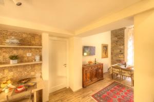 a room with a kitchen and a dining room at DUOMO LUXURY APARTMENT "Palazzo del Re" in Florence