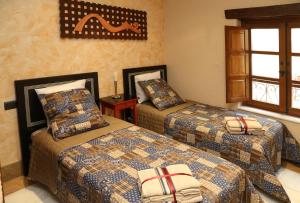 A bed or beds in a room at Espectacular apartamento junto a la Plaza Mayor by My Home in Salamanca