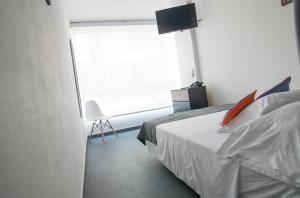 Postel nebo postele na pokoji v ubytování Hotel Grand H&R