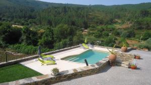 A piscina em ou perto de Casa da Ladeira, Turismo Rural