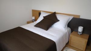 Uma cama ou camas num quarto em Casa da Ladeira, Turismo Rural