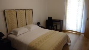 Uma cama ou camas num quarto em Casa da Ladeira, Turismo Rural