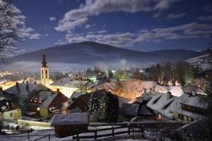 a town covered in snow at night at Haus Helga in Mauterndorf