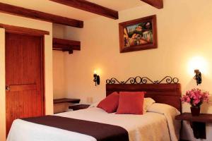 Postel nebo postele na pokoji v ubytování Hotel Posada Real Tapalpa