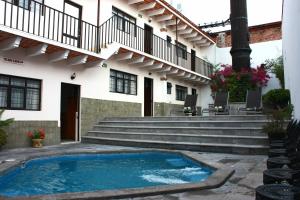 a swimming pool in front of a building at Casa Blanca Tequisquiapan in Tequisquiapan