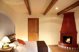 Postel nebo postele na pokoji v ubytování Hotel Posada Real Tapalpa