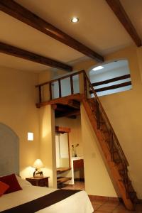 Postel nebo postele na pokoji v ubytování Hotel Posada Real Tapalpa