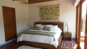 מיטה או מיטות בחדר ב-Casa Pixan