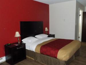 Postel nebo postele na pokoji v ubytování Econo Lodge