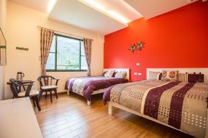 Una cama o camas en una habitación de 春夏秋冬民宿