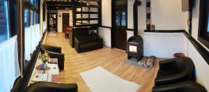 a living room with a wood stove in a room at Casa Demeter in Rimetea