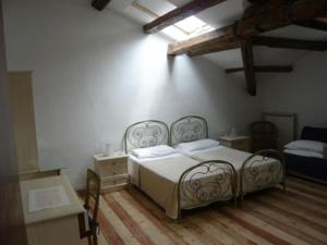 Кровать или кровати в номере Villa Gabriella B&B - Apartments