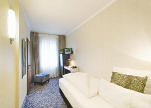 Postel nebo postele na pokoji v ubytování Top Hotel Krämer