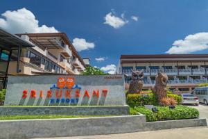 a sign for thessant agency in front of a building at Srisuksant Resort in Ao Nang Beach