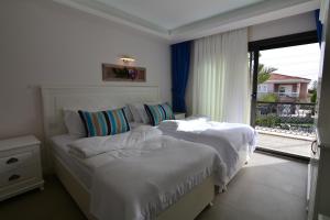 מיטה או מיטות בחדר ב-Dalyan Risus Suite
