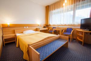 מיטה או מיטות בחדר ב-Hotel Špik