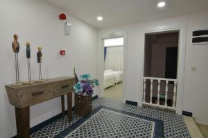 a room with a desk and a room with a bed at Dalyan Risus Suite in Çeşme
