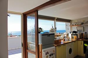 a kitchen with a view of the ocean at Apartment Martucci with Seaview in Naples