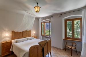 Postel nebo postele na pokoji v ubytování Agriturismo Maso Lizzone